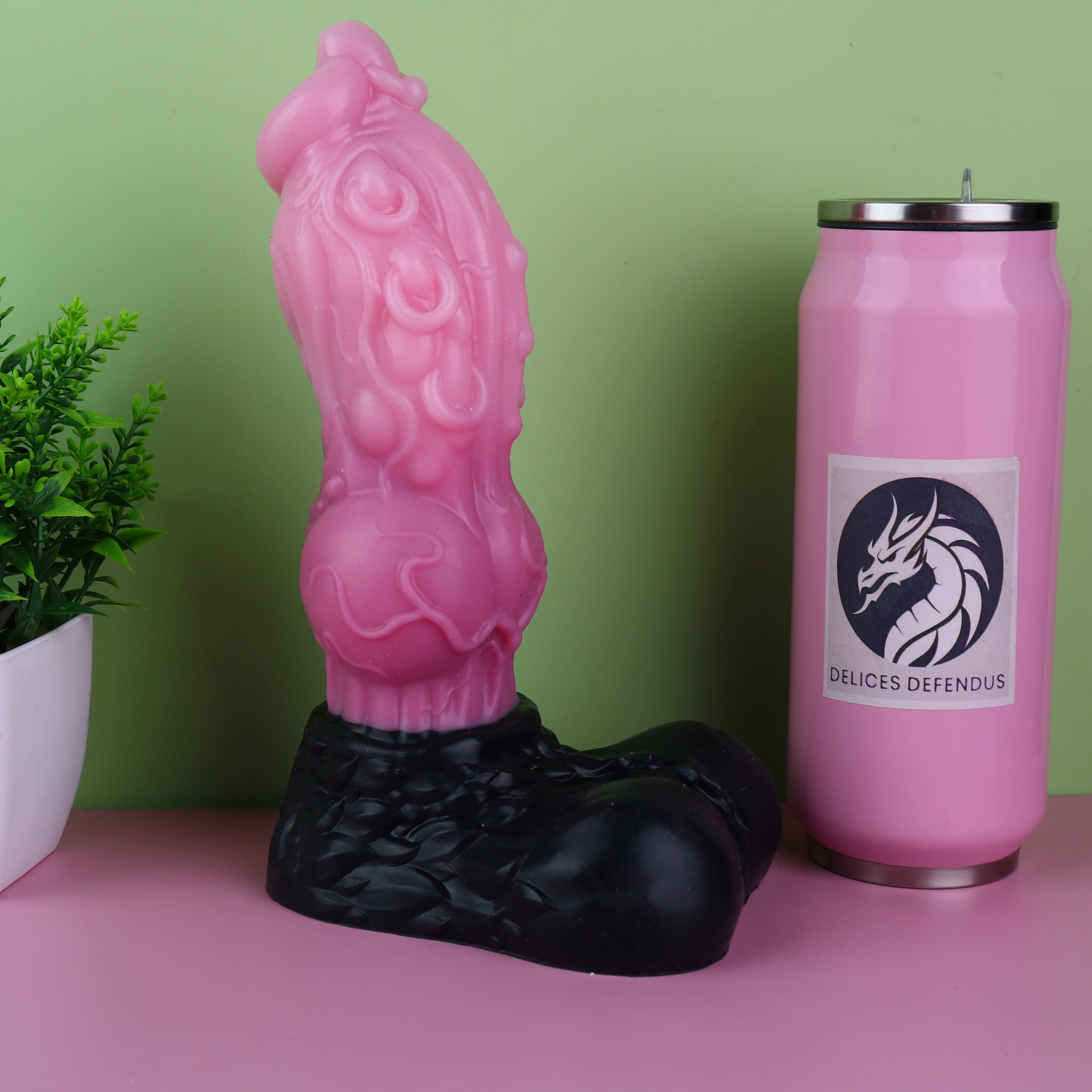 Vibrant pink Loona from Helluva Boss futa dildo with shaft piercings and exaggerated knot for locking pleasure black base contrast medical-grade platinum silicone