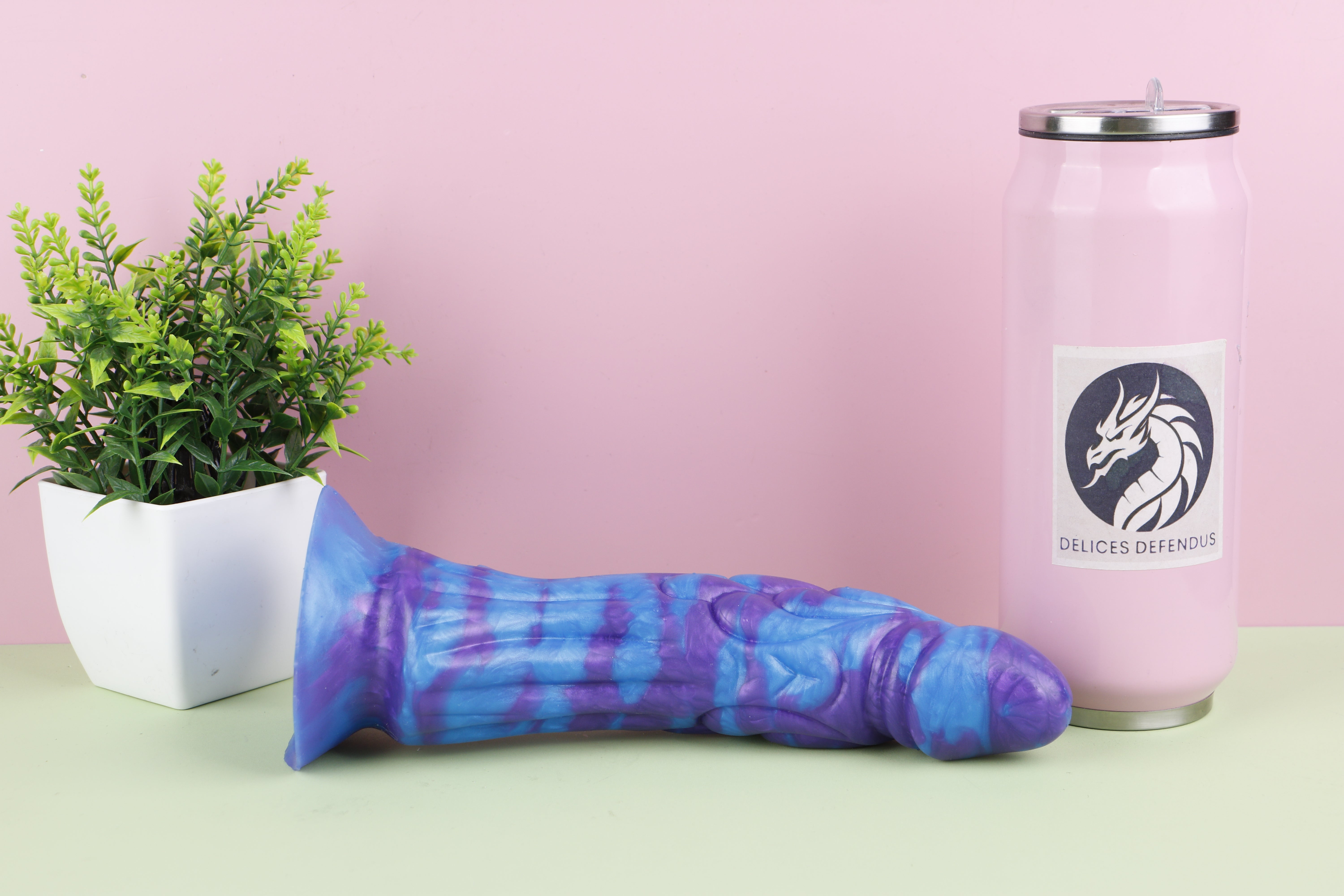 Large furry dildo with realistic knot and fantasy creature design made from soft platinum silicone.
